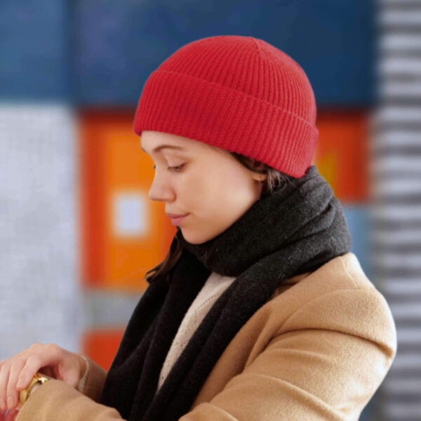 Bright red knit marathon beanie being word