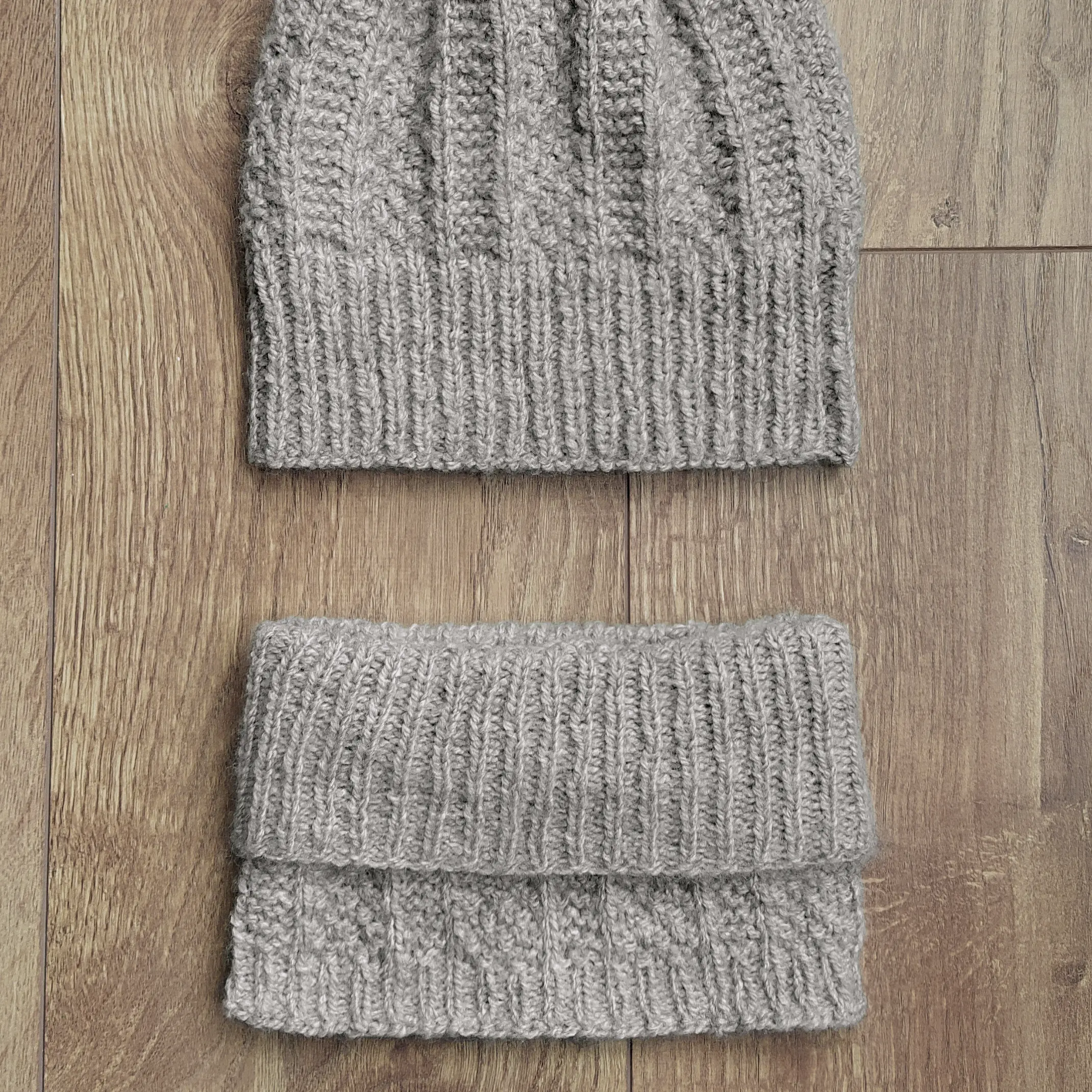 Flatlay of the cambronne cowl folded outward and the matching beanie