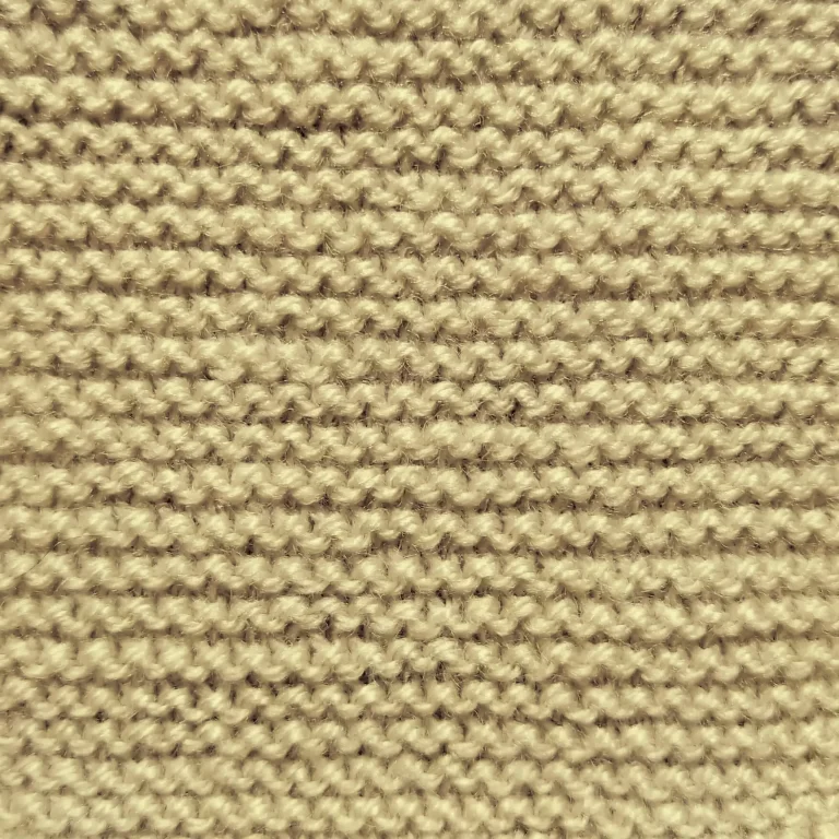 Close up of a garter stitch knitting swatch. Knit by KnitQ.