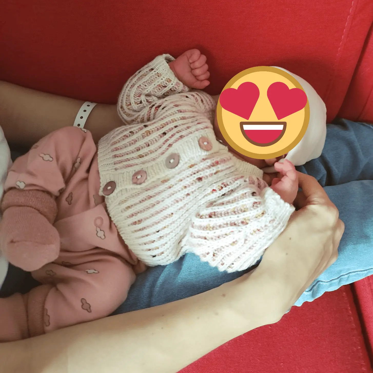 The marionberry newborn cardigan being worn