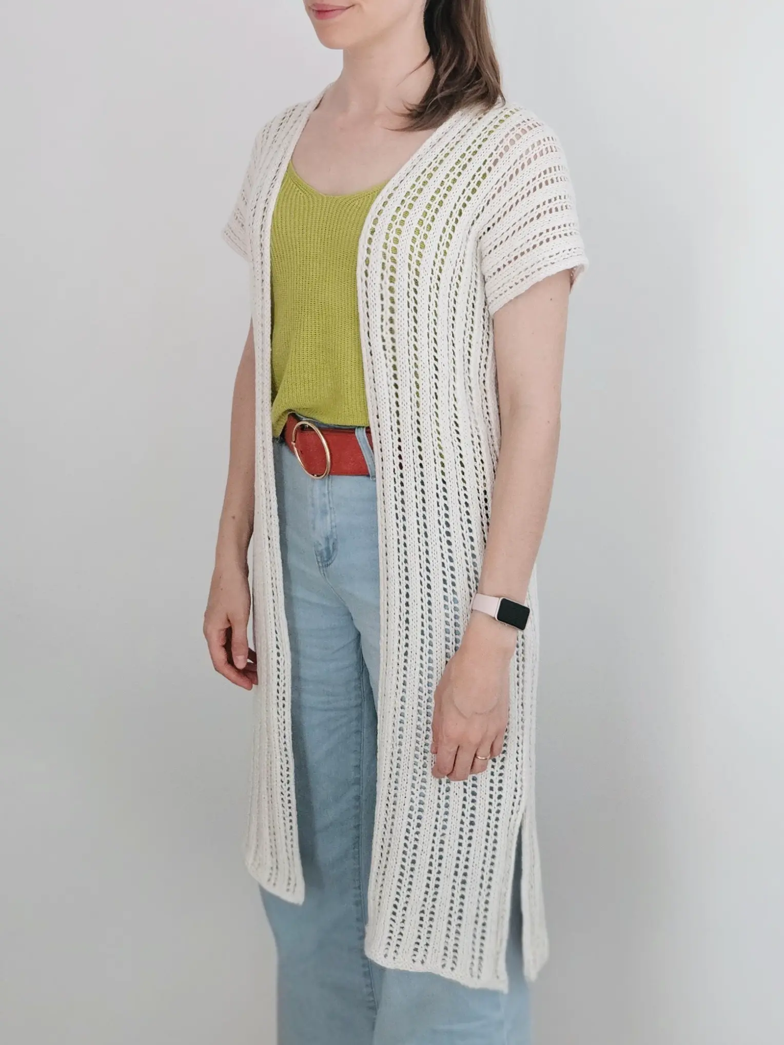 The reya swimsuit cover-up worn over a lime green tanktop and jeans with a burnt orange belt
